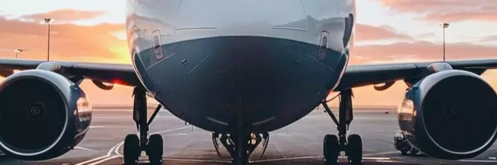 a plane stands at the airport