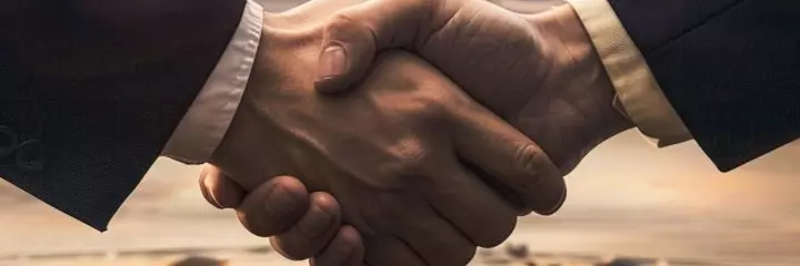 Handshake with an airplane in the background