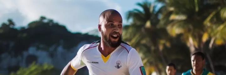 People are playing beach soccer
