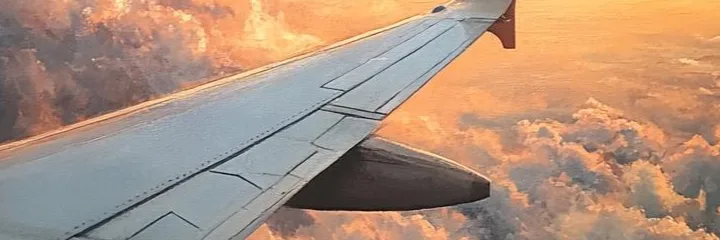 An airplane above the clouds